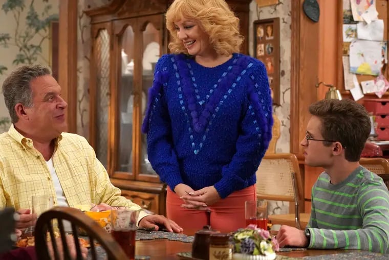 This image released by ABC shows Wendi McLendon-Covey (center) as Beverly Goldberg, Jeff Garlin (left) as Murray Goldberg, and Sean Giambrone as Adam Goldberg in a scene from the comedy series "The Goldbergs."
