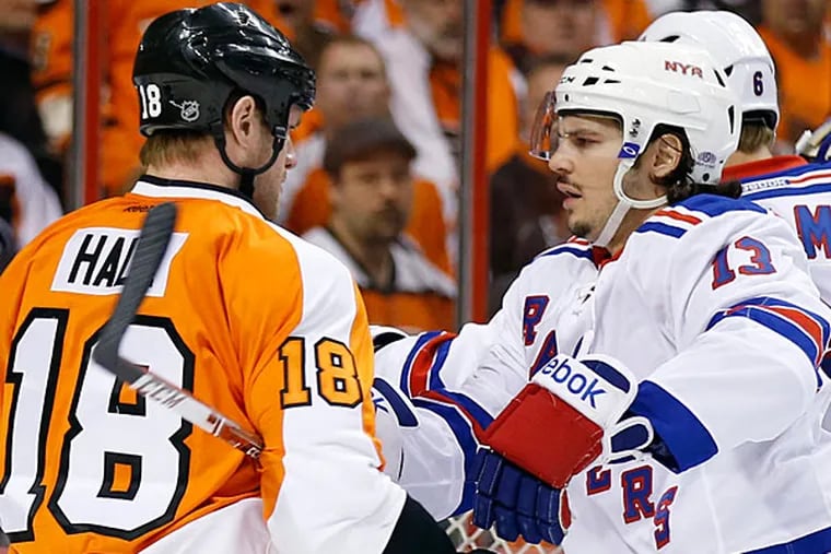 Adam Hall and the Rangers' Daniel Carcillo during Game 3. (Yong Kim/Staff Photographer)