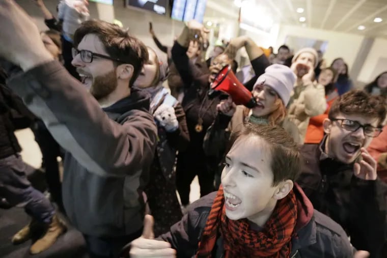 Demonstrators at Philadelphia International Airport protested President Donald Trump's ban of refugees and immigrants from seven Muslim-majority countries in January 2017.