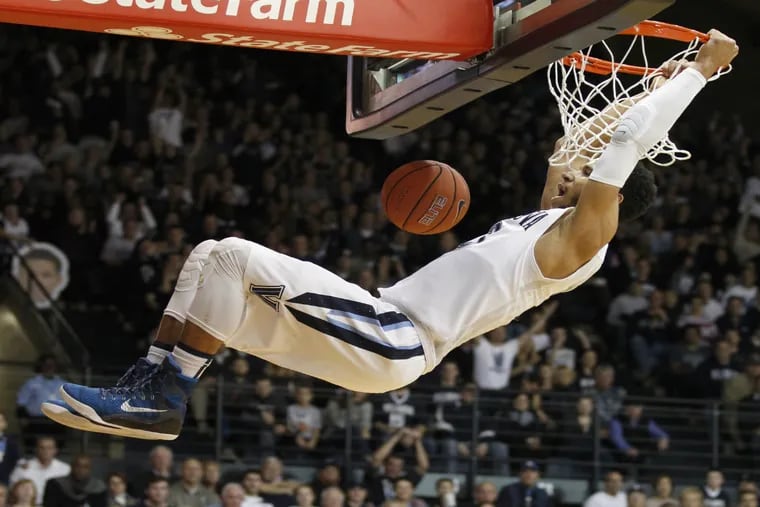 Josh Hart of Villanova celebrates as he dunks the ball early in the 2nd half of their 95-64 upset of 6th-ranked Xavier at the Pavilion on Dec. 31, 2015.  Hart had 15 points.
