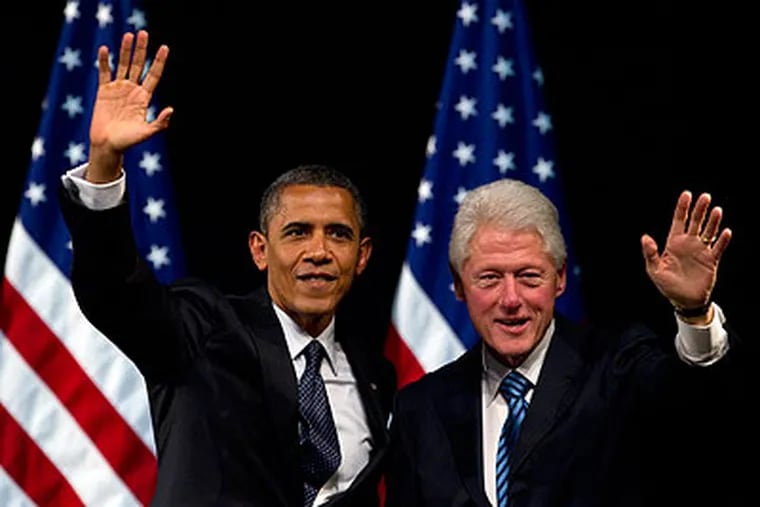 President Obama and former President Bill Clinton stumping June 4 in New York. George W. Bush, by contrast, has been absent from GOP campaigning. (Carolyn Kaster / Associated Press)