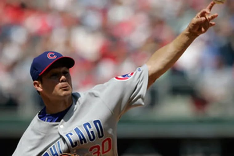 Cubs pitcher Ted Lilly throws a change-up for a strike to Aaron Rowand in the fourth inning, when the Phillies were still hitless.