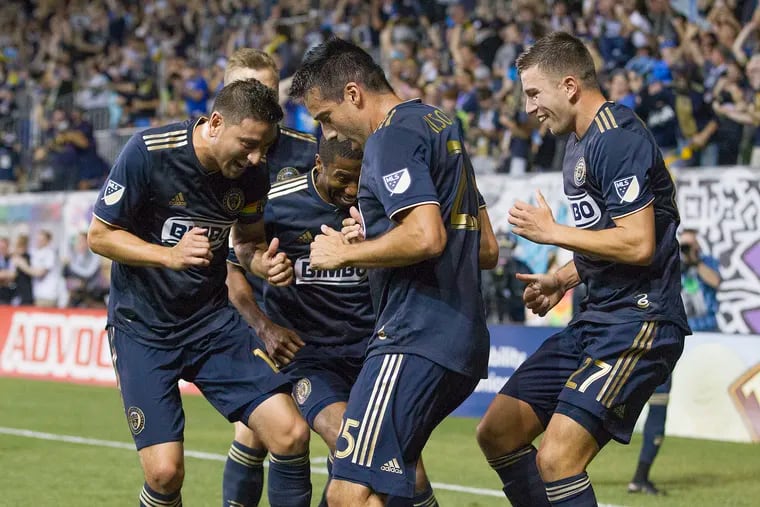 Ilsinho (center) celebrating a goal in one of his most famous games for the Union, when he scored twice to spark a big comeback in a 3-2 win over the New York Red Bulls on June 8, 2019.