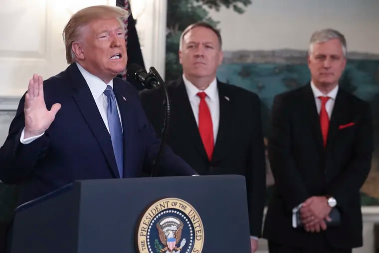President Donald Trump delivers remarks on Syria, next to Secretary of the State Mike Pompeo and National Security Advisor Robert C. O'Brien, right, in the Diplomatic Reception Room of the White House on Wednesday, Oct. 23, 2019 in Washington, D.C.