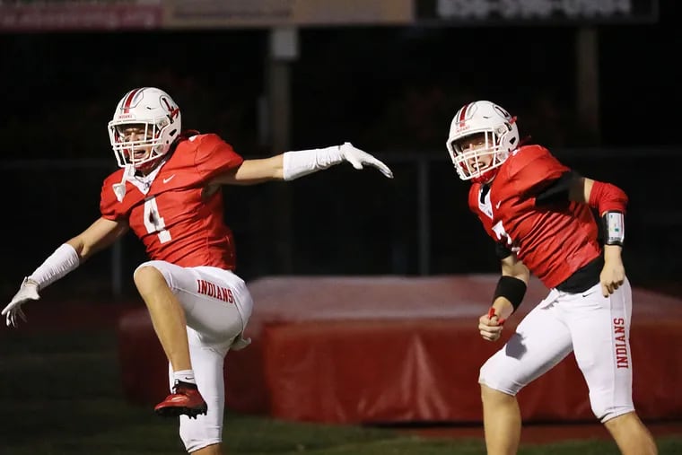 Lenape's Connor Kennedy (left) celebrates his touchdown reception in the second quarter with Brady Long.
