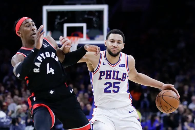 Sixers guard Ben Simmons commits an offensive foul on Toronto Raptors forward Rondae Hollis-Jefferson during the first quarter.