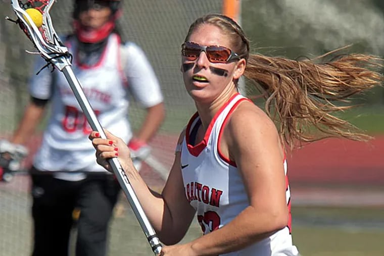 Hilary Lemonick is a Cornell-bound senior defender for the 2013
PIAA-champion Harriton girls' lacrosse team who is battling diabetes.
Here, she carries the ball up the field during a home game Tuesday
against Strath Haven.   (LOU RABITO / Staff)