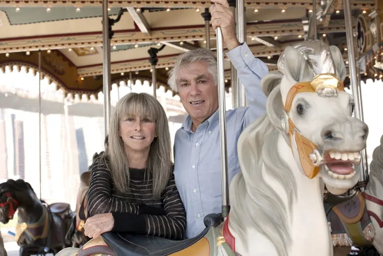 Jane and David Walentas on the carousel Jane Walentas restored over a quarter of a century. Photo: Julienne Schafer