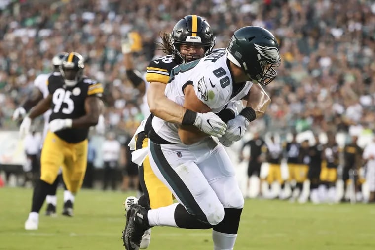 Eagles tight end Dallas Goedert scores a second-quarter touchdown past Pittsburgh Steelers linebacker Anthony Chickillo in a preseason game on Thursday, August 9, 2018 in Philadelphia. DAVID MAIALETTI / Staff Photographer
