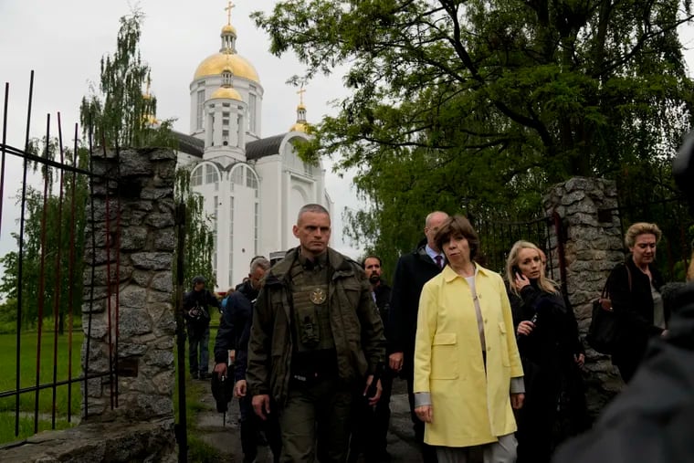 French Foreign Minister Catherine Colonna visits Bucha's church, on the outskirts of Kyiv, Ukraine, Monday, May 30, 2022.
