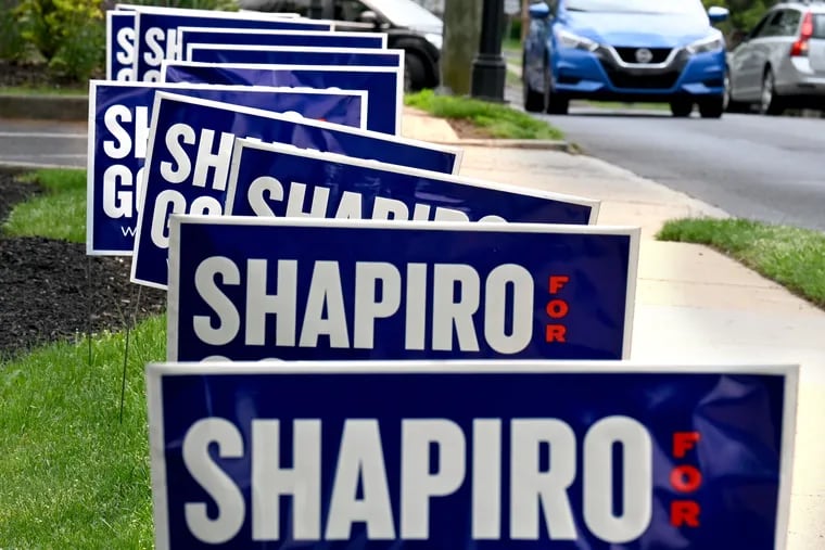 Campaign signs along Main Street in Doylestown in May for Josh Shapiro, the Democratic candidate for governor.