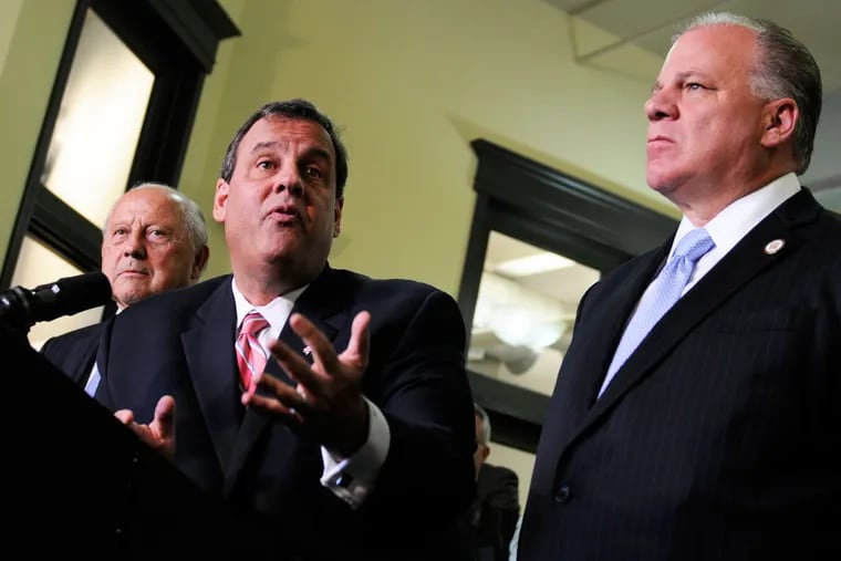 Gov. Christie (center) speaks during a press conference in Atlantic City at the end of a second summit meeting he convened Nov. 12, 2014. Senate President Stephen Sweeney is at right.