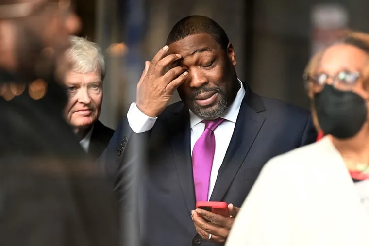 City Councilmember Kenyatta Johnson pauses inside the federal courthouse in Center City on April 12. His attorney Patrick Egan is at left.