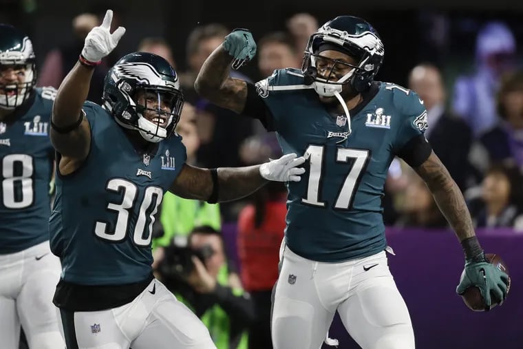 Eagles running back Corey Clement, left, and Eagles wide receiver Alshon Jeffery, right. celebrate Jeffery's touchdown catch at Super Bowl LII, at U.S. Bank Stadium in Minneapolis, Minnesota, Sunday, Feb. 4, 2018. YONG KIM / Staff Photographer.
