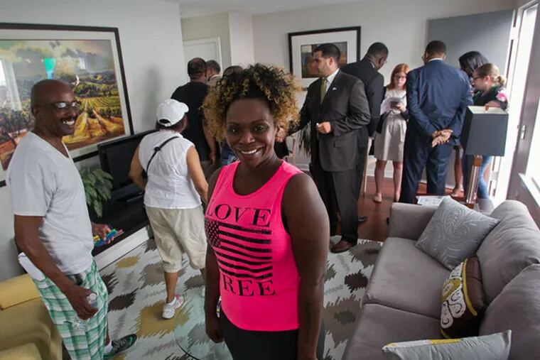 Latoya Wright, who had been on the waiting list for public housing for over a decade, in a new
Philadelphia Housing Authority housing unit in Strawberry Mansion. (ALEJANDRO A. ALVAREZ / Staff Photographer)