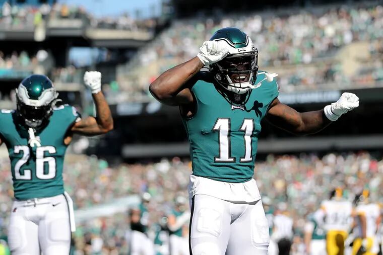 Eagles wide receiver A.J. Brown (right) celebrates his first touchdown of the game against the Steelers at Lincoln Financial Field on Sunday.