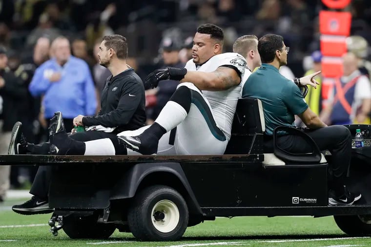 Eagles guard Brandon Brooks is carted off the field after tearing his Achilles tendon on Sunday.