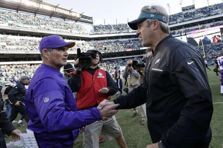 Eagles coach Doug Pederson, right, shaking hands with Vikings coach Mike Zimmer after their teams’ game last season.