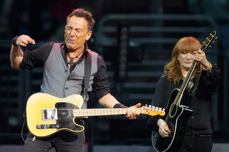Bruce Springsteen and his wife, Patti Scialfa, during a 2016 concert at the Wells Fargo Center. Both will be among the musicians performing during "Jersey 4 Jersey," a one-night remote concert to raise funds to help fight COVID-19 in New Jersey.