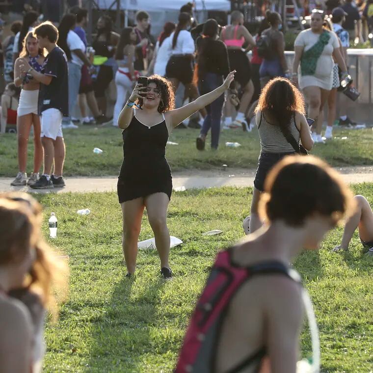 People dance from afar as Young Thug performs on the first day of the Made in America festival on Sept. 4, 2021. Events such as that have been cited for why Gen Zers are preferring big cities like Philly.