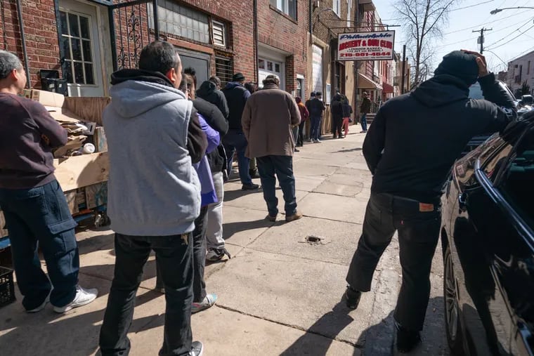 A line of people wait outside of the Philadelphia Gun and Archery Club in South Philadelphia on Wednesday.