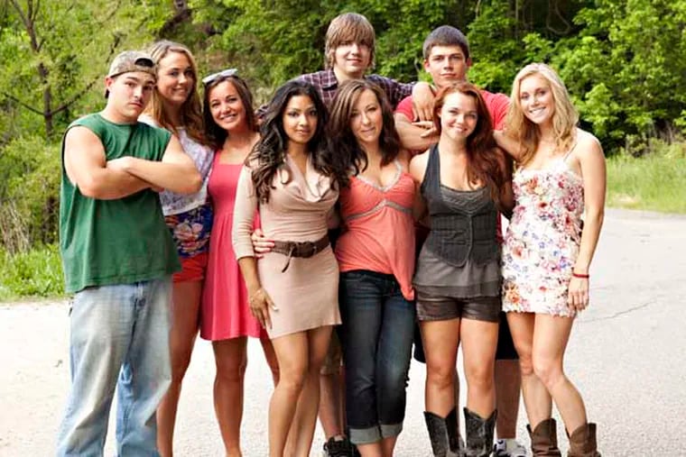 FILE - This undated image originally released by MTV shows the cast of the new reality series "Buckwild," from left, Shain Gandee, Anna, Katie, Salwa, Joey, background center, Ashley, Tyler, background right, Cara and Shae. MTV said Wednesday, April 10, 2013, it is canceling its West Virginia-based reality TV show "Buckwild" a week after the accidental death of 21-year-old star Shain Gandee. Network spokesman Jake Urbanski confirmed the news, saying it was "not an easy decision." (AP Photo/MTV, file)