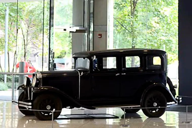 Visitors to the National Constitution Center are greeted by 1920's automobile, near entrance to new exhibit, "American Spirits: The Rise and Fall of Prohibition." ( TOM GRALISH / Staff Photographer )