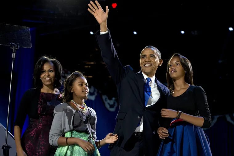 President Barack Obama, First Lady Michelle Obama, and their daughters Malia and Sasha on election night in 2012.