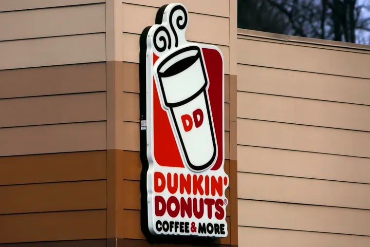 FILE- This Jan. 22, 2018, file photo shows the Dunkin' Donuts logo on a shop in Mount Lebanon, Pa. (AP Photo/Gene J. Puskar, File)
