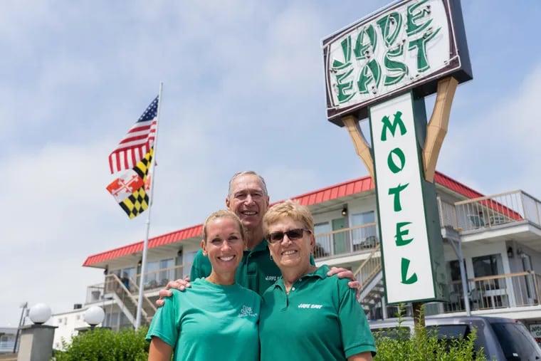 Part of Lawrence family Liz Short, Steve and Jane Lawrence pose for a portrait in front of the entrance at Jade East Motel in North Wildwood, New Jersey.