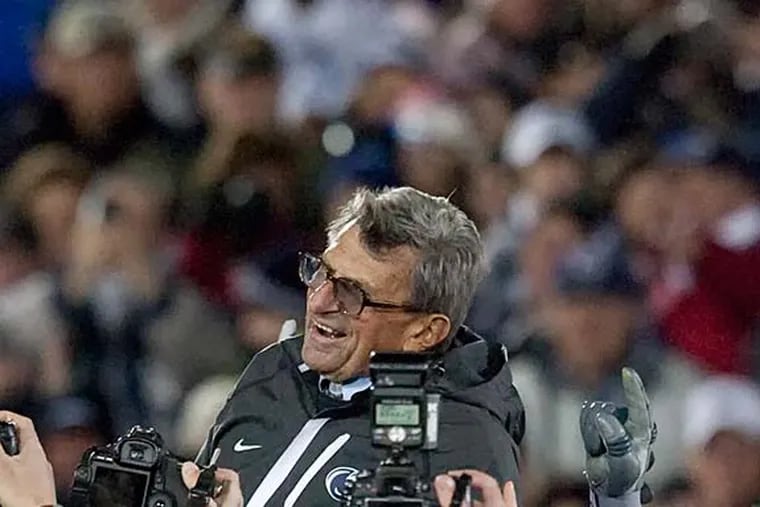 Penn State's Joe Paterno is hoisted by his team after the Nittany Lions' 35-21 win over Northwestern. (Ed Hille/Staff Photographer)