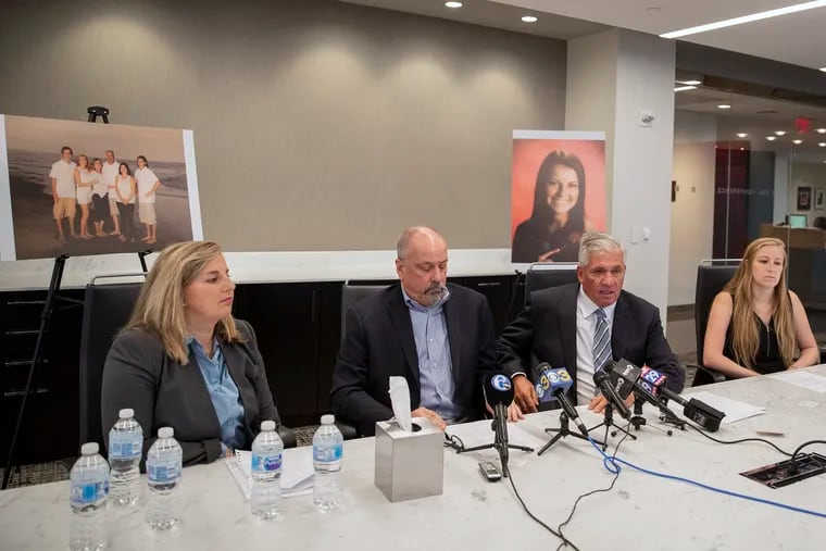 From left, Jacqueline Burleigh, Ed Burleigh, attorney Robert Mongeluzzi, and Janelle Burleigh at a news conference Sept. 18, 2019, announcing a lawsuit against Pub Webb and Joshua Hupperterz, who was convicted of killing Jenna Burleigh, 22, in 2017. Photos of Jenna Burleigh by herself and with her family are in the background.