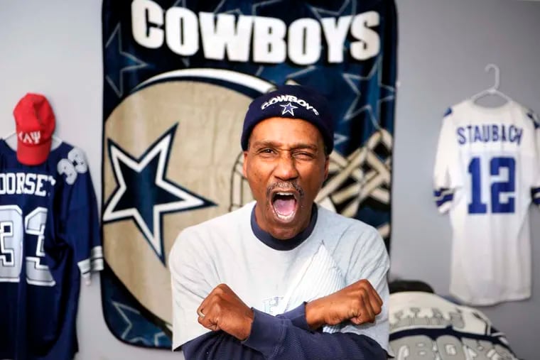 Craig Coles is a huge Cowboys fan. He poses in his "Cowboys Room," the office in his Sicklerville house, on November 25, 2014, the eve of the Eagles-Cowboys game. ( TOM GRALISH / Staff Photographer )