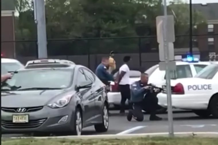 Altaif Hassan, a Rowan University senior, was being handcuffed while an officer pointed a rifle at his passenger, Gianna Roberson, a freshman during the controversial car stop on Monday.