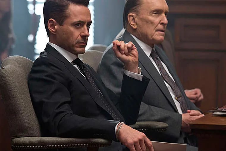 Robert Downey Jr. (left) is a lawyer and Robert Duvall is his father - and the defendant - in "The Judge." (Warner Bros. Pictures)