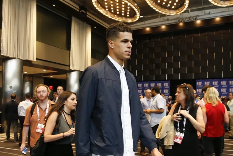 Michael Porter Jr., walks to his table before meeting with the media during the NBA pre-draft top prospect availability on Wednesday, June 20, 2018 in New York. YONG KIM / Staff Photographer