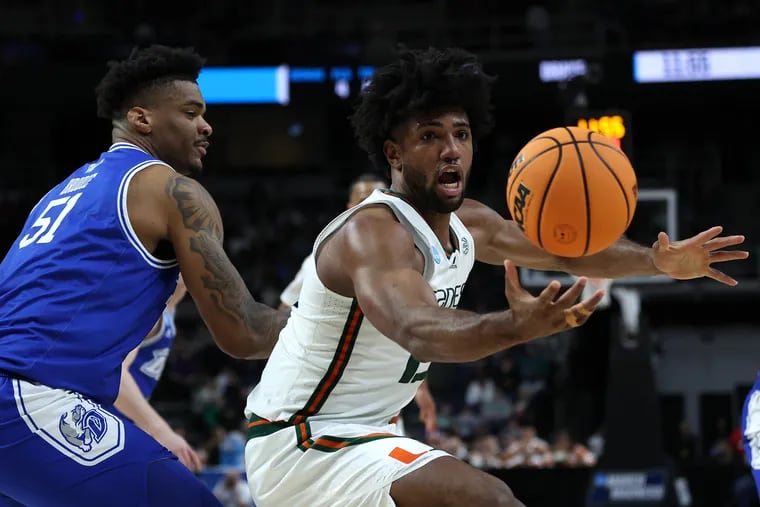 Miami forward Norchad Omier (right) played through an injured ankle Friday and had 12 points and 14 rebounds in a come-from-behind NCAA Tournament win against Drake. The fifth-seeded Hurricanes will face No. 4 seed Indiana in a second-round Midwest Region contest Sunday. (Photo by Patrick Smith/Getty Images)