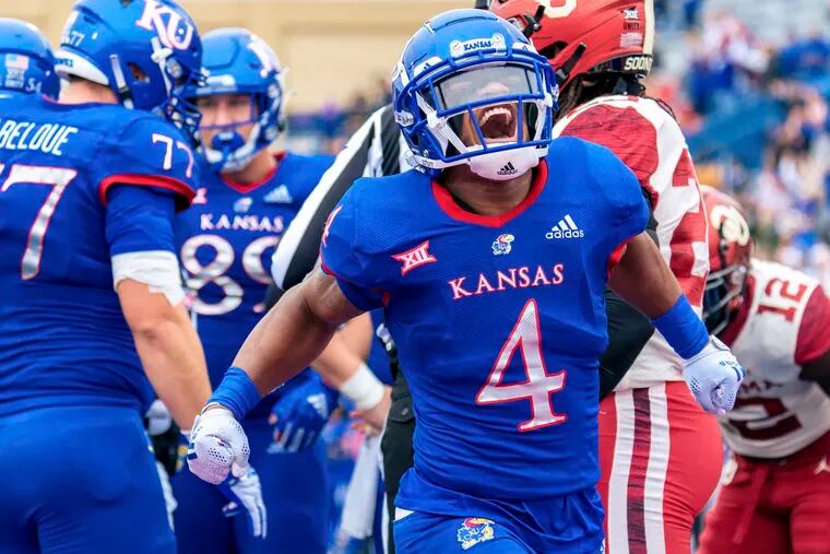 Devin Neal (4) of the Kansas Jayhawks celebrates after scoring a touchdown against the Oklahoma Sooners in the first quarter at David Booth Kansas Memorial Stadium on Oct. 23, 2021, in Lawrence, Kansas. (Kyle Rivas/Getty Images/TNS)