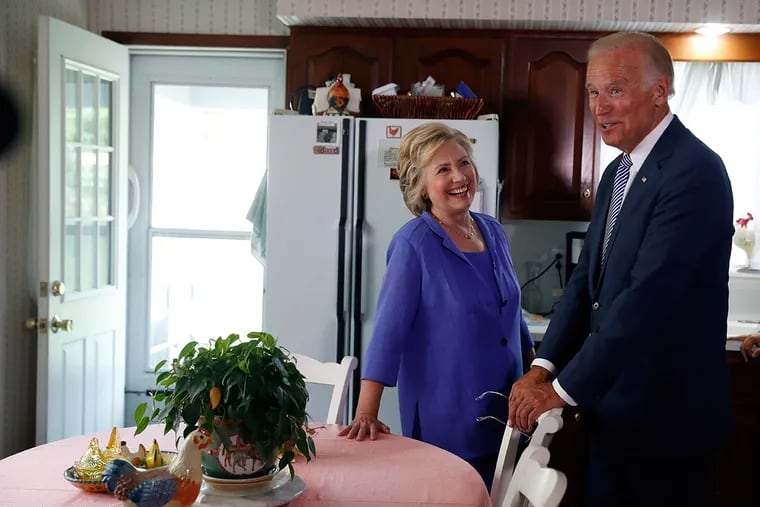 Democratic presidential candidate Hillary Clinton and Vice President Joe Biden stand in the kitchen of Biden's childhood home now owned by Anne Kearns in Scranton, Pa., Monday, Aug. 15, 2016.
