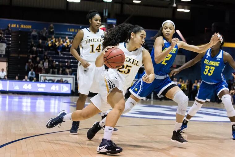 Drexel senior forward Kelsi Lidge dribbles past Delaware players during the second half of Drexel’s 58-53 overtime win over Delaware in the CAA women’s basketball tournament at Daskalakis Athletic Center on Friday, March 9, 2018.