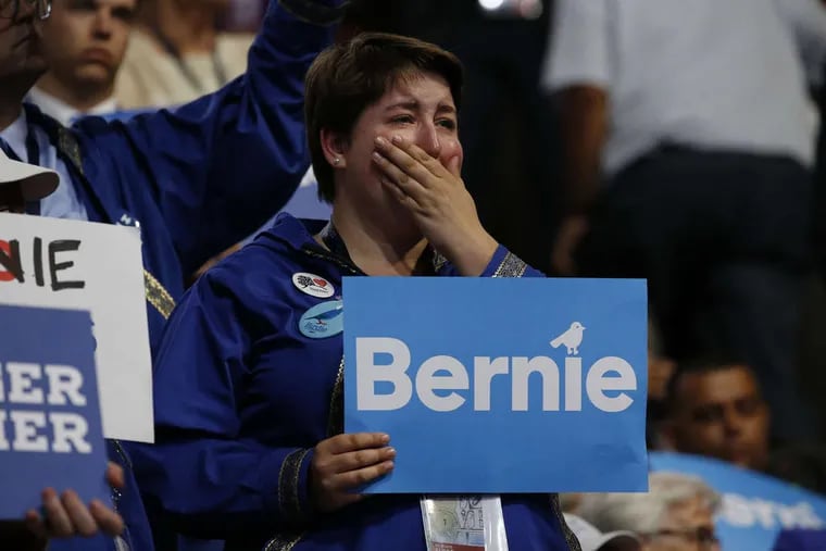 An Alaskan delegate is overcome with emotion as she listens to Bernie Sanders give his speech on Monday night at the DNC.