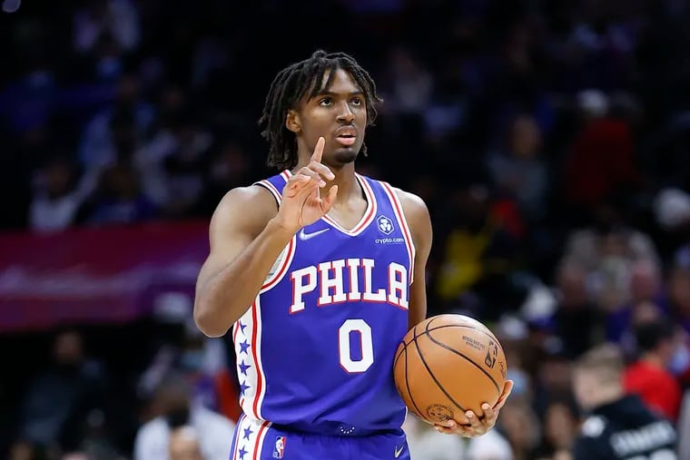 Sixers guard Tyrese Maxey points his finger holding the basketball against the Orlando Magic on Monday, November 29, 2021 in Philadelphia.