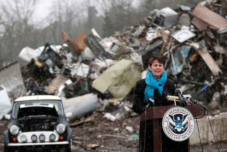 Brenda Smith, assistant commissioner for the Office of International Trade of U.S. Customs and Border Protection, speaks before the car was wrecked, right.