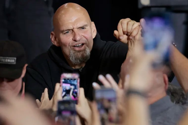 Pennsylvania Lt. Governor and U.S. Senate candidate John Fetterman shakes hands with supporters after his rally at Montgomery County Community College in Blue Bell, Pa.
