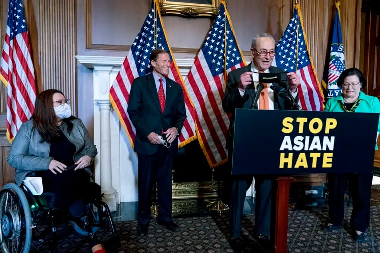 Senate Majority Leader Chuck Schumer of N.Y., accompanied by Sen. Mazie Hirono, D-Hawaii, Sen. Tammy Duckworth, D-Ill., and Sen. Richard Blumenthal, D-Conn., speaks at a news conference after the Senate passed a COVID-19 Hate Crimes Act.