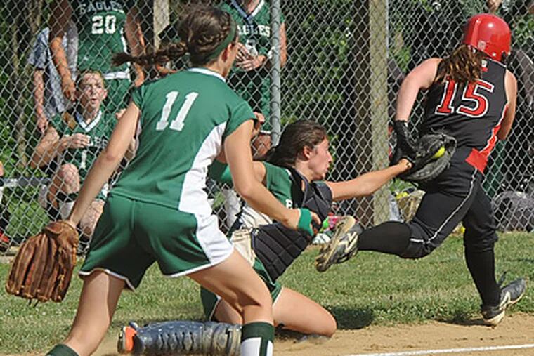 Taylor Barbalace of Shanahan watches the catcher, Maria Ficca of Shanahan, tag  the runner out between third base and home plate. (Bob Williams/ For the Inquirer)