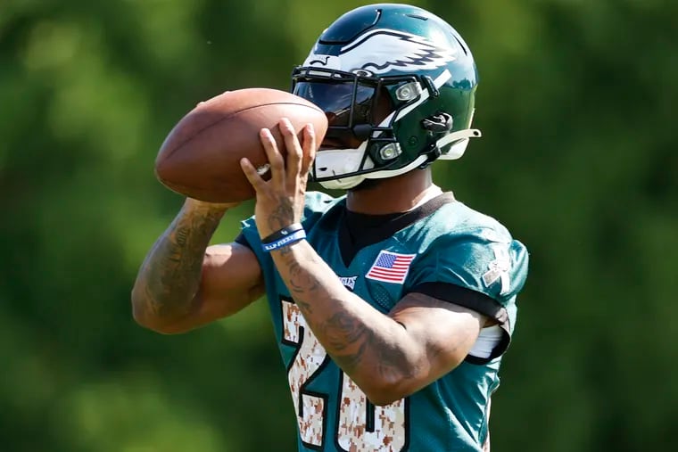 Eagles running back Miles Sanders catches the football during training camp Saturday at the NovaCare Complex.