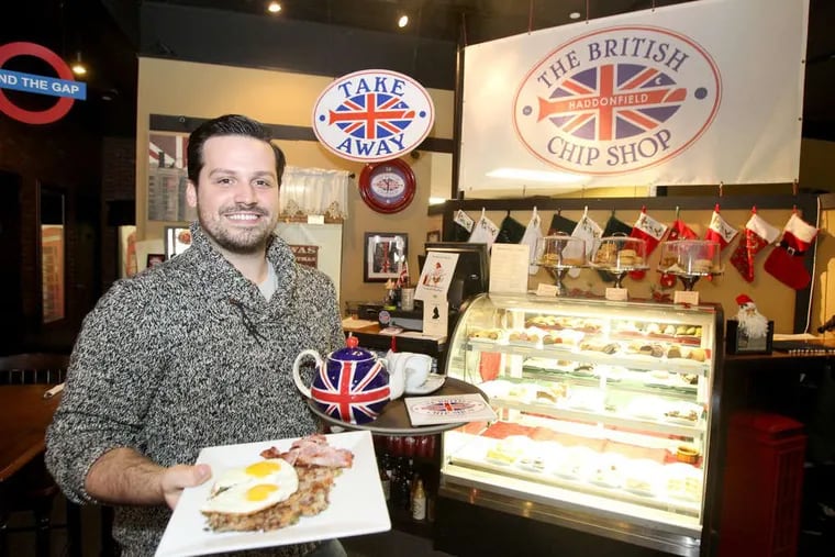 Edward Strojan, owner of the British Chip Shop, in 2012 with a plate full of bubble and squeak with eggs and a pot of tea.