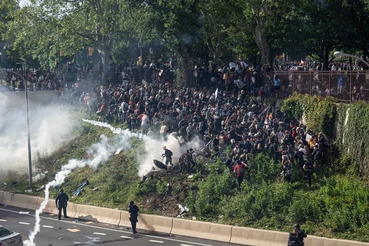 Police use tear gas to disperse protestors who descended onto the Vine Street Expressway and blocked traffic in Philadelphia on June 1.