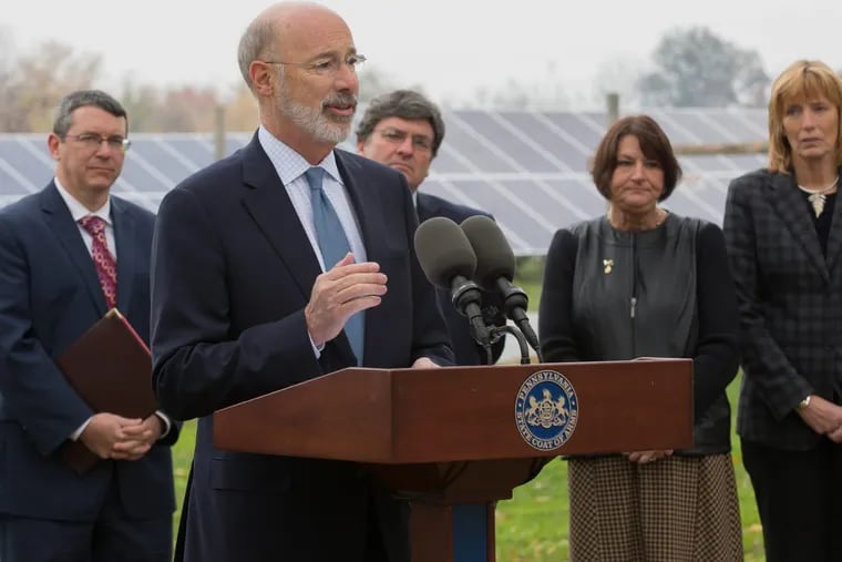 Gov. Wolf, surrounded by state officials, announces a new effort 11/13/2017 to boost solar energy in Pennsylvania at an event at a solar installationin Elizabethtown, Pa., that is owned and operated by Community Energy Solar. The state’s solar industry grew for the second year in a row.